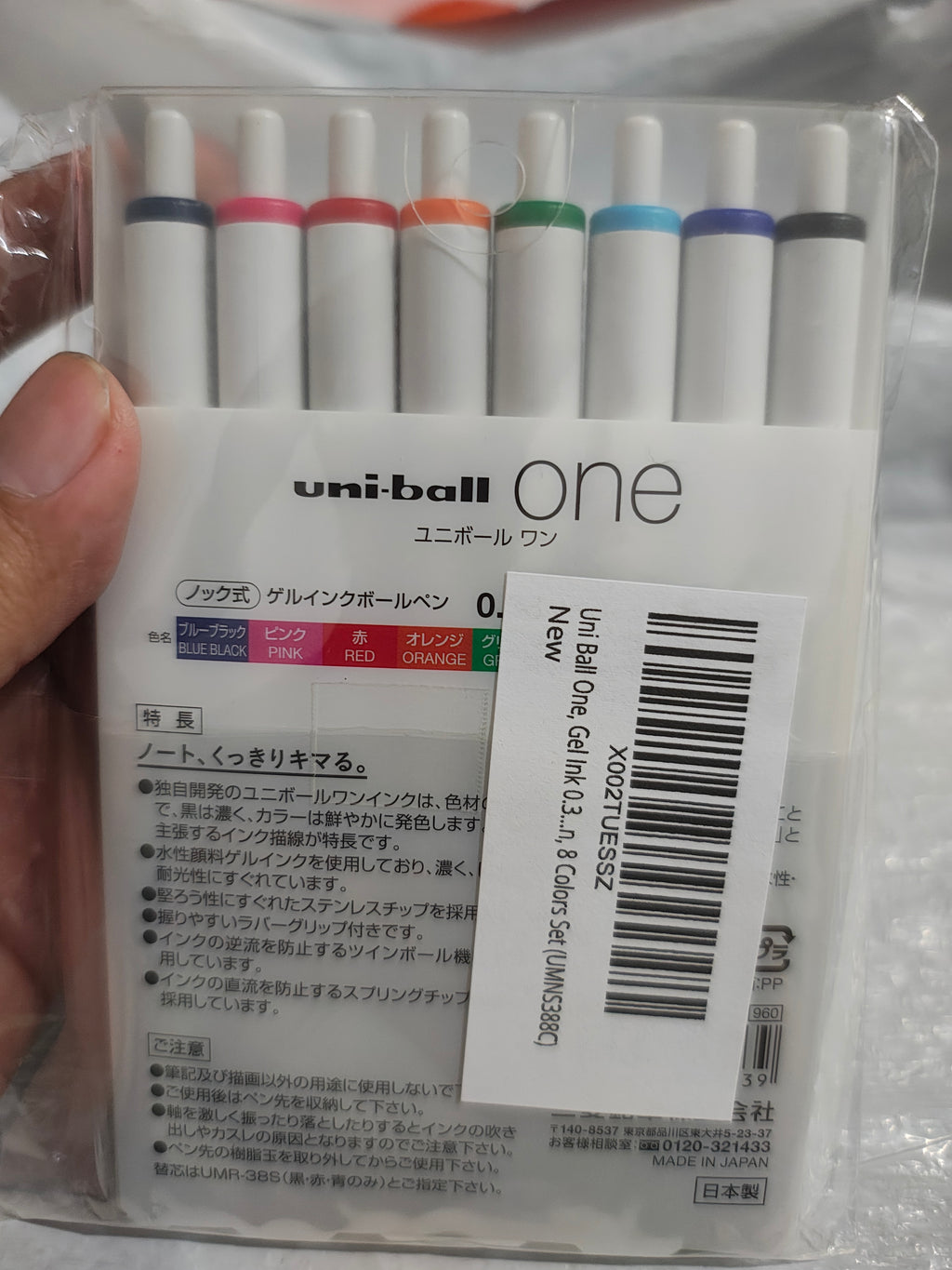 Reverso del empaque Uni-ball One con los 8 colores de tinta, hecho en Japón